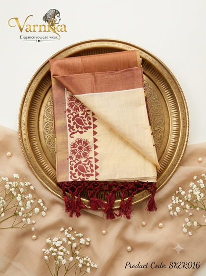 SKER016 - Maroon & Gold Printed Kerala Tissue Saree with Hand-Tied Tassels